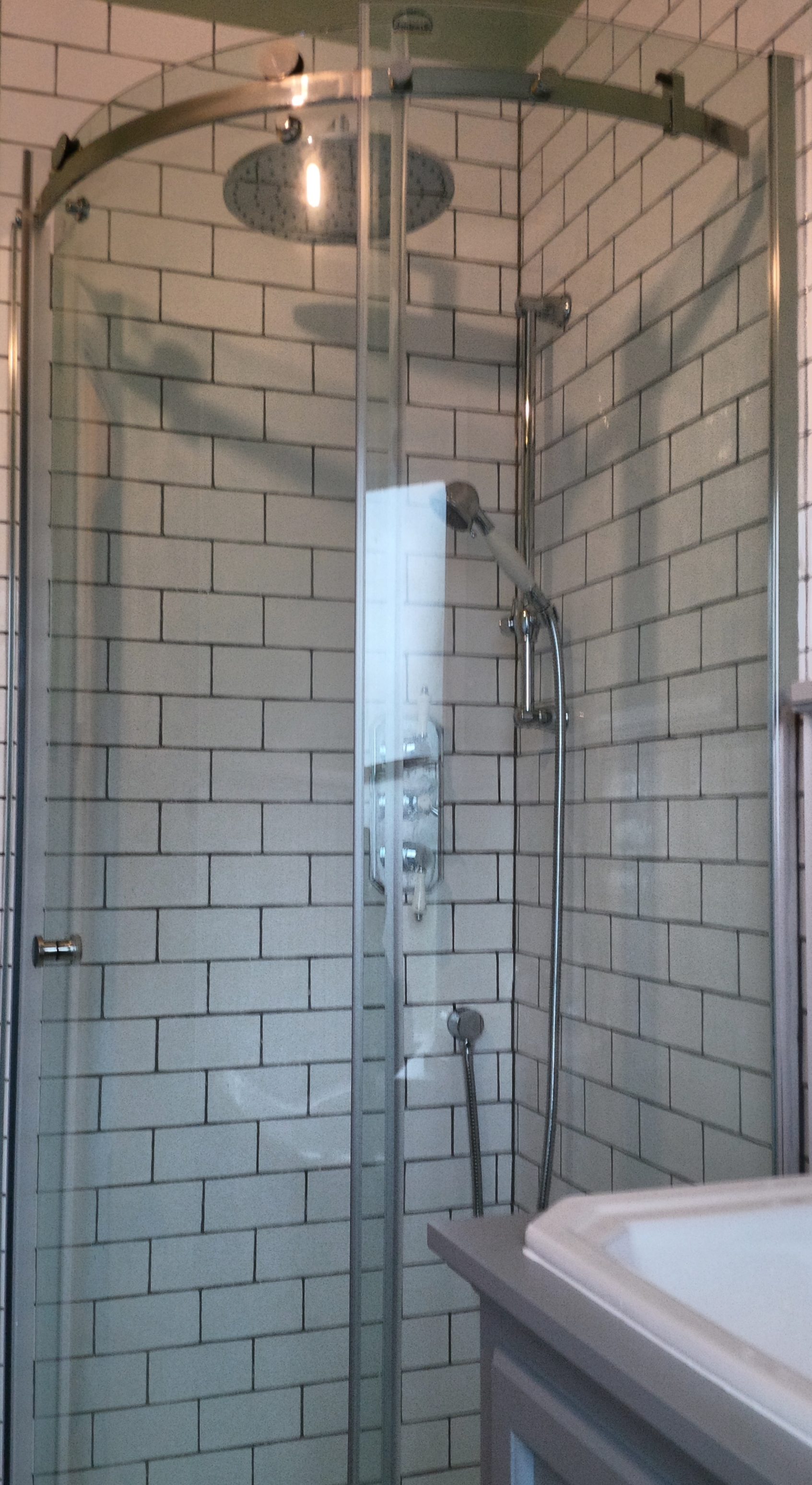 Quadrant shower with a thermostatic shower valve, fixed head shower and Richmond Bathrooms