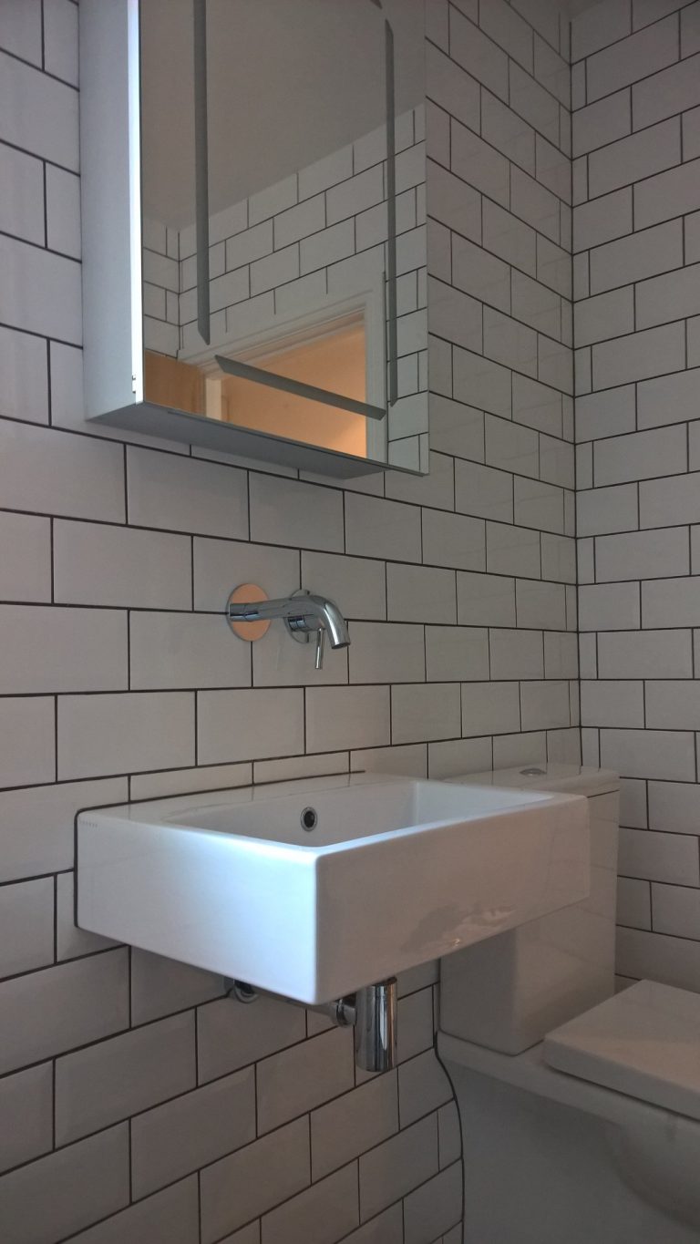 Traditional metro wall tiling with dark grey grout