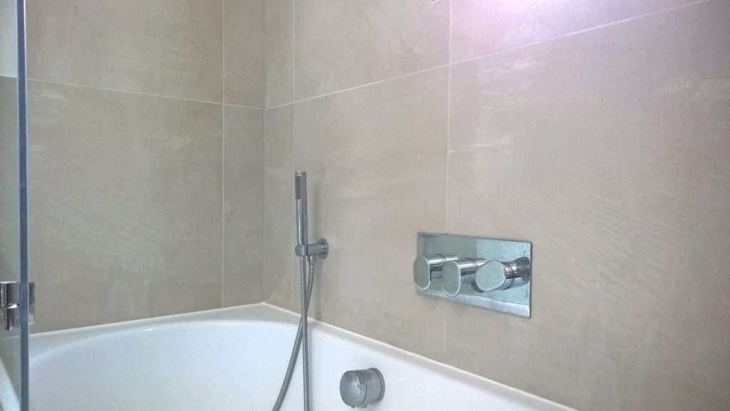 A bath and shower valve used to control a bath overflow filler