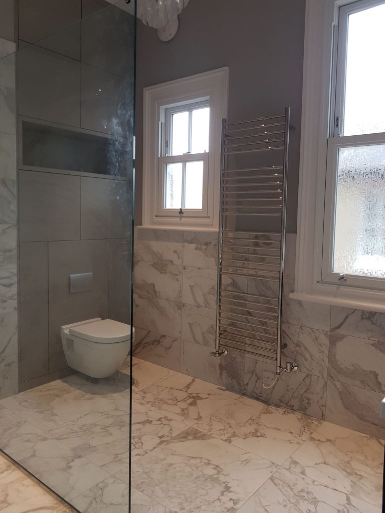Half wall tiling with Carrara marble