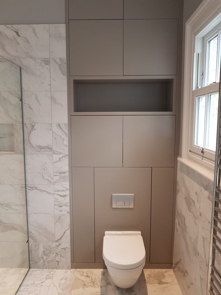 Wall hung WC with storage cupboards